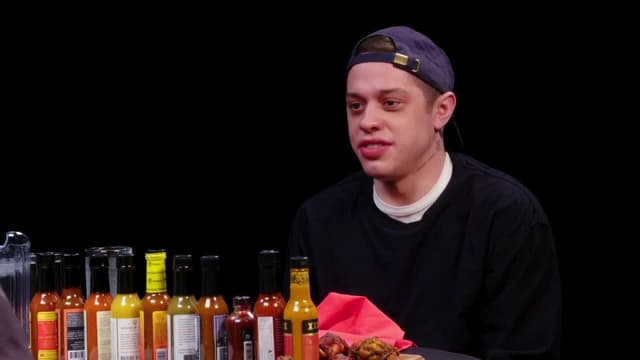 S11:E05 - Pete Davidson Drips With Sweat While Eating Spicy Wings