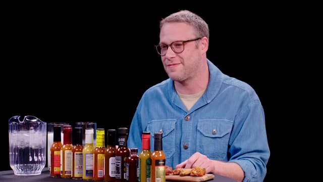 S17:E01 - Seth Rogen Scorches His Tongue While Eating Spicy Wings