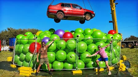S01:E01 - Can 1000 Exercise Balls Bounce a Falling Car?