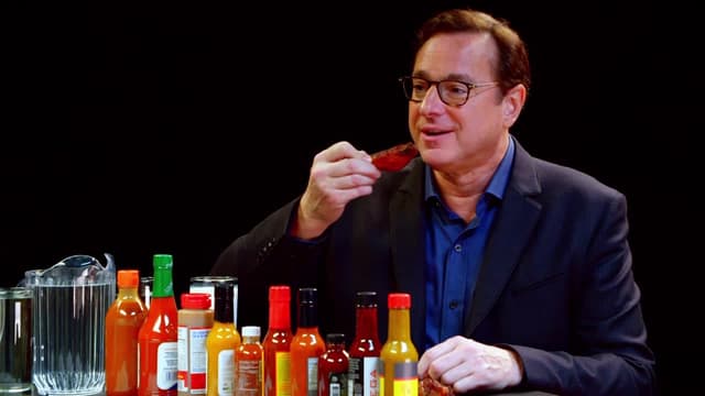S04:E18 - Bob Saget Hiccups Uncontrollably While Eating Spicy Wings