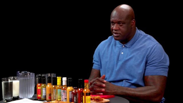 S08:E08 - Shaq Tries to Not Make a Face While Eating Spicy Wings