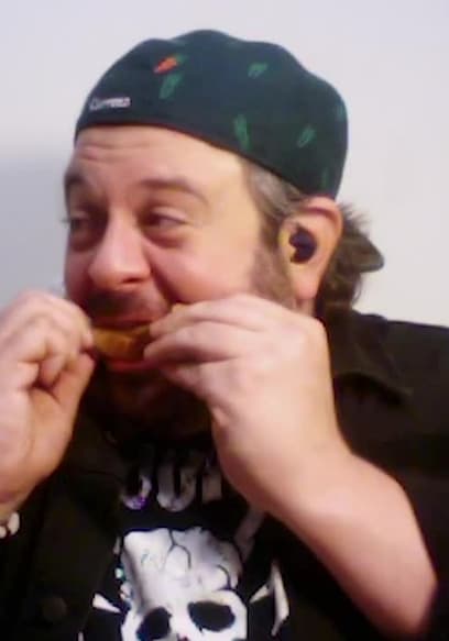S12:E07 - Adam Richman Impersonates Noel Gallagher While Eating Spicy Wings poster